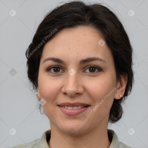 Joyful white adult female with medium  brown hair and brown eyes