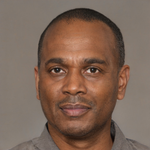 Neutral latino adult male with short  black hair and brown eyes