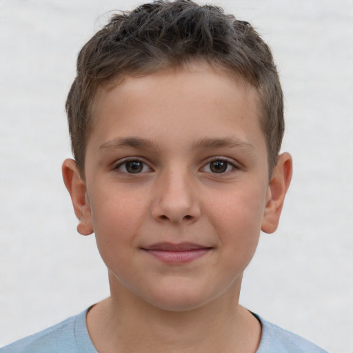 Joyful white child male with short  brown hair and brown eyes