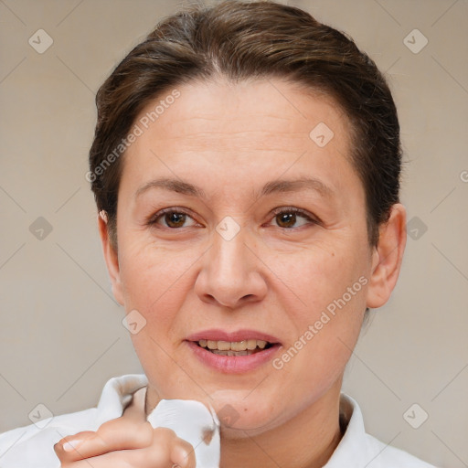 Joyful white adult female with short  brown hair and brown eyes