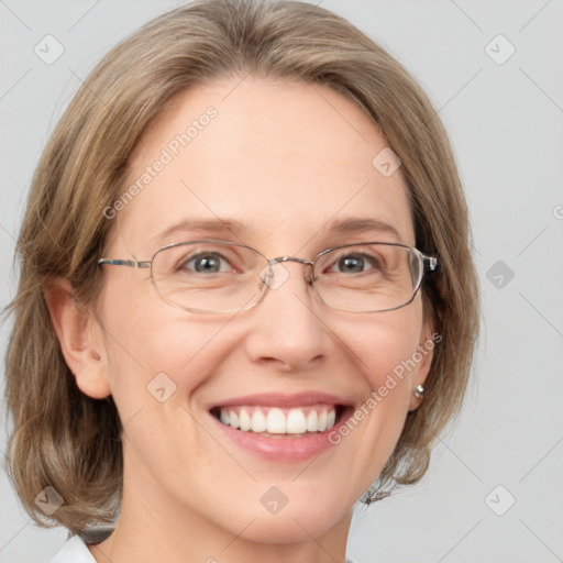 Joyful white adult female with medium  brown hair and blue eyes