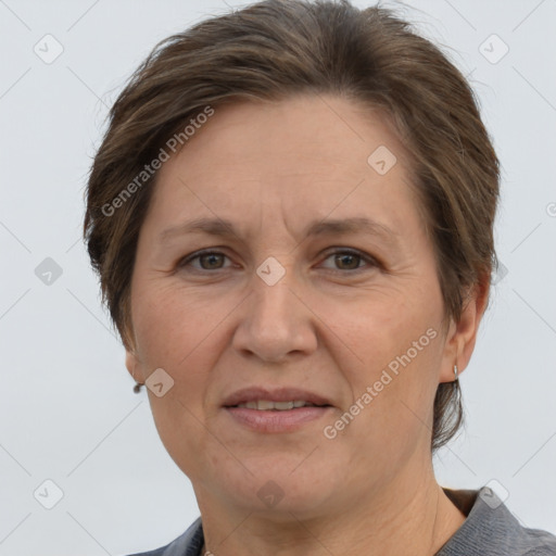 Joyful white adult female with short  brown hair and grey eyes