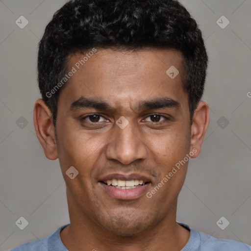 Joyful black young-adult male with short  brown hair and brown eyes