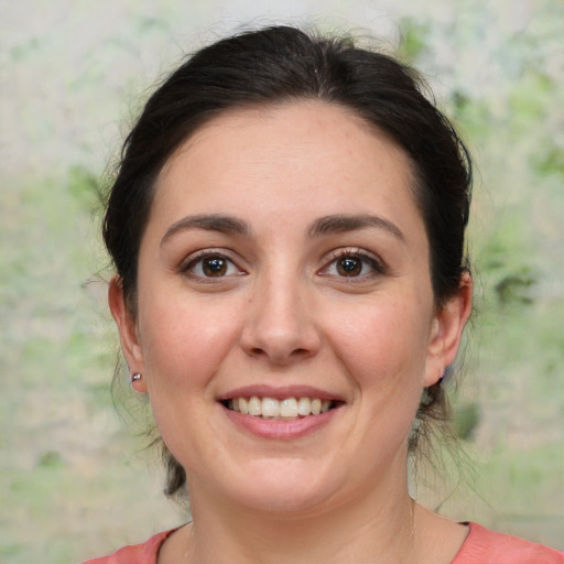 Joyful white young-adult female with medium  brown hair and brown eyes