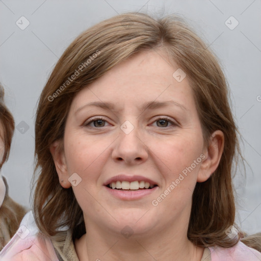 Joyful white young-adult female with medium  brown hair and blue eyes