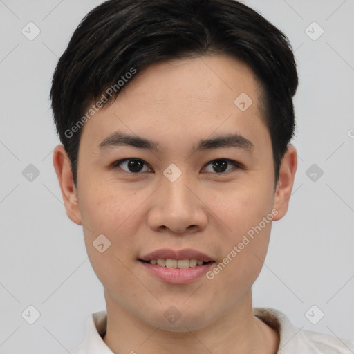 Joyful asian young-adult male with short  black hair and brown eyes