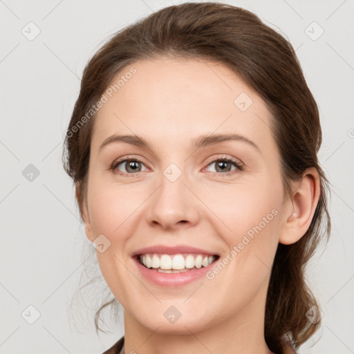 Joyful white young-adult female with medium  brown hair and grey eyes