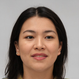 Joyful asian young-adult female with medium  brown hair and brown eyes