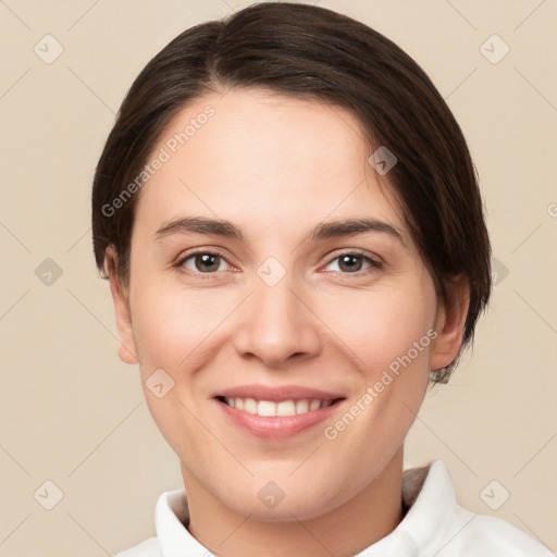 Joyful white young-adult female with short  brown hair and brown eyes