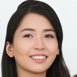 Joyful asian young-adult female with long  brown hair and brown eyes