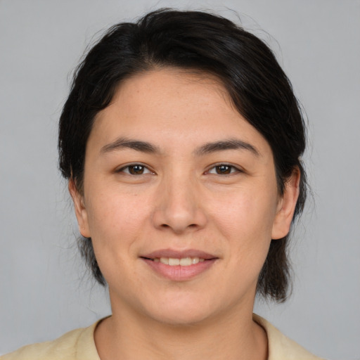 Joyful white young-adult female with medium  brown hair and brown eyes