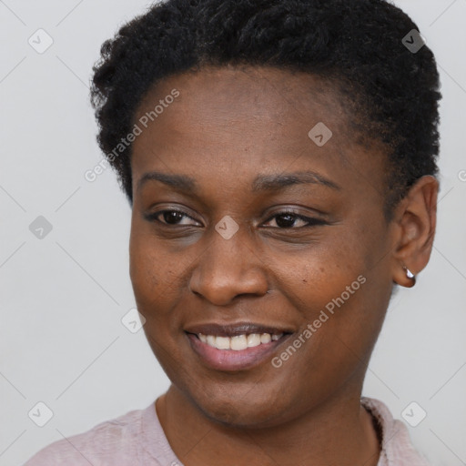 Joyful black young-adult female with short  brown hair and brown eyes