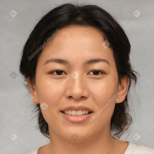 Joyful asian young-adult female with medium  brown hair and brown eyes