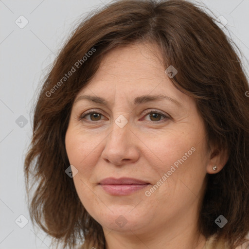 Joyful white adult female with medium  brown hair and brown eyes