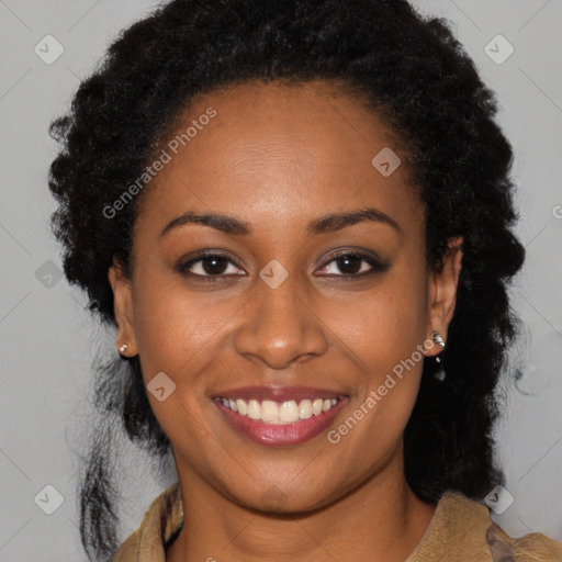 Joyful black young-adult female with long  brown hair and brown eyes