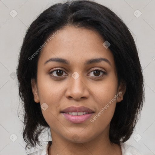 Joyful latino young-adult female with medium  brown hair and brown eyes