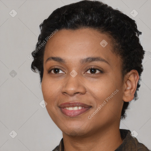 Joyful black young-adult female with short  black hair and brown eyes