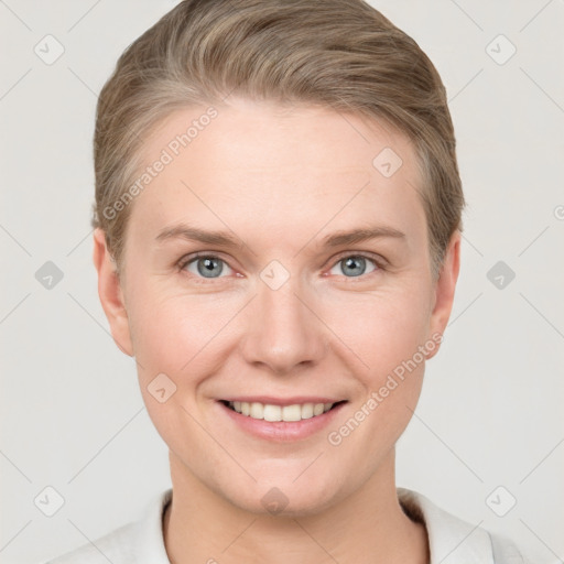 Joyful white young-adult female with short  brown hair and grey eyes