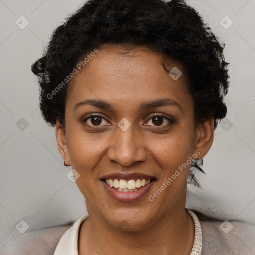 Joyful black young-adult female with short  brown hair and brown eyes