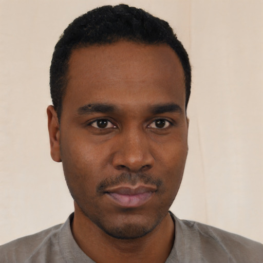 Neutral black young-adult male with short  black hair and brown eyes