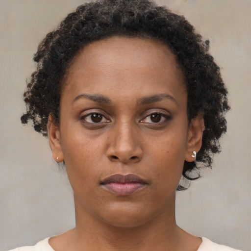 Neutral black young-adult female with short  brown hair and brown eyes