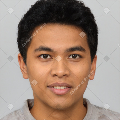 Joyful latino young-adult male with short  brown hair and brown eyes