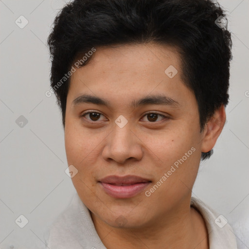 Joyful asian young-adult male with short  brown hair and brown eyes