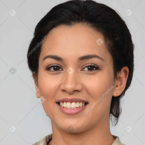 Joyful latino young-adult female with medium  brown hair and brown eyes