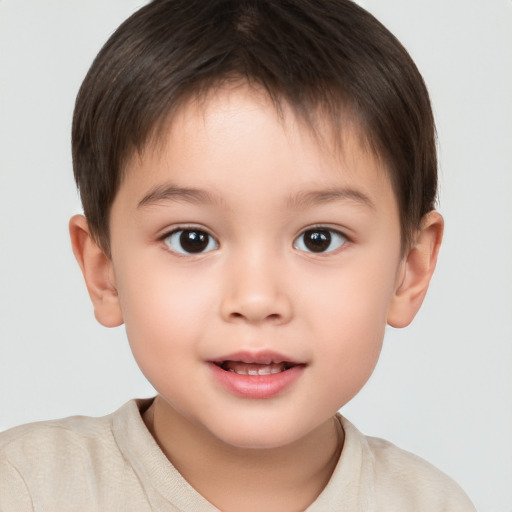 Joyful white child male with short  brown hair and brown eyes