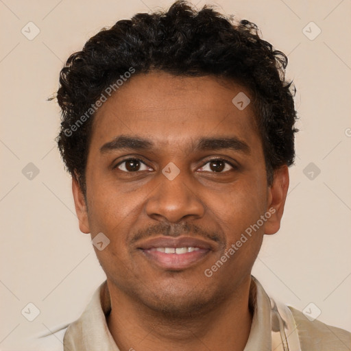 Joyful black young-adult male with short  brown hair and brown eyes