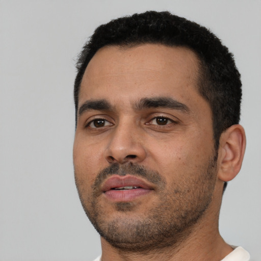 Neutral latino young-adult male with short  black hair and brown eyes