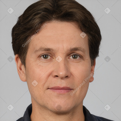 Joyful white adult male with short  brown hair and brown eyes