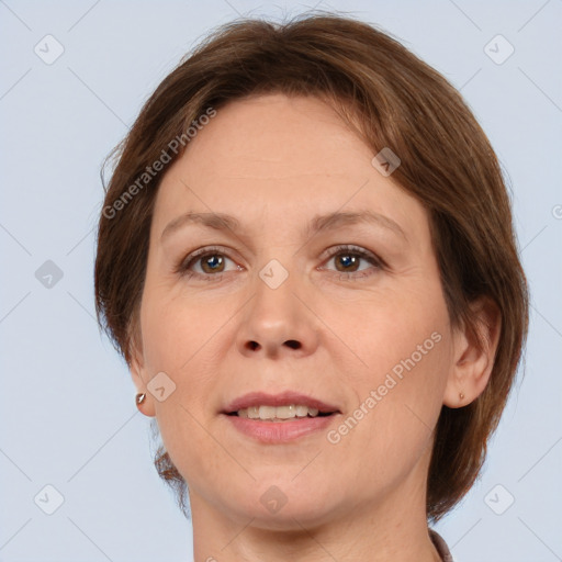 Joyful white adult female with medium  brown hair and brown eyes