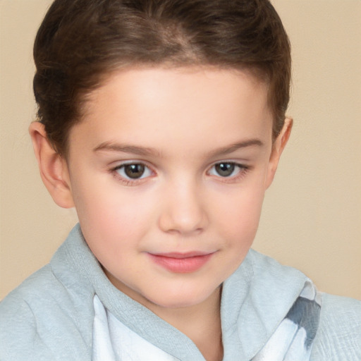 Joyful white child female with short  brown hair and brown eyes