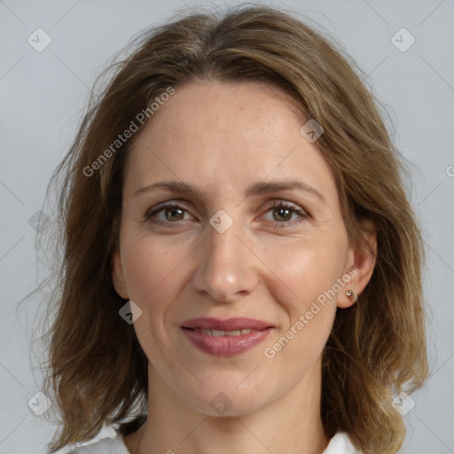 Joyful white adult female with medium  brown hair and grey eyes