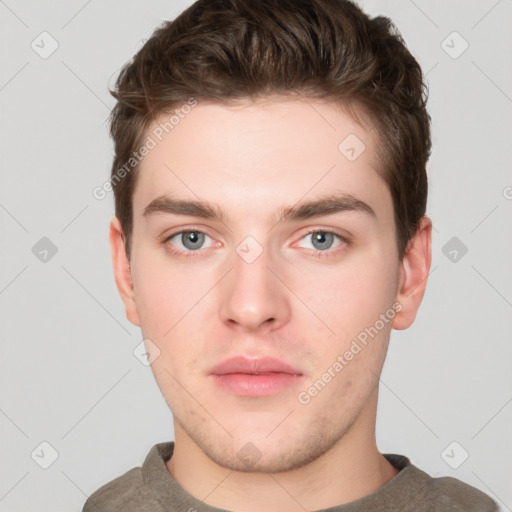 Neutral white young-adult male with short  brown hair and grey eyes