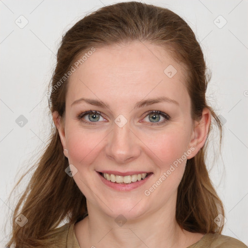 Joyful white young-adult female with medium  brown hair and green eyes