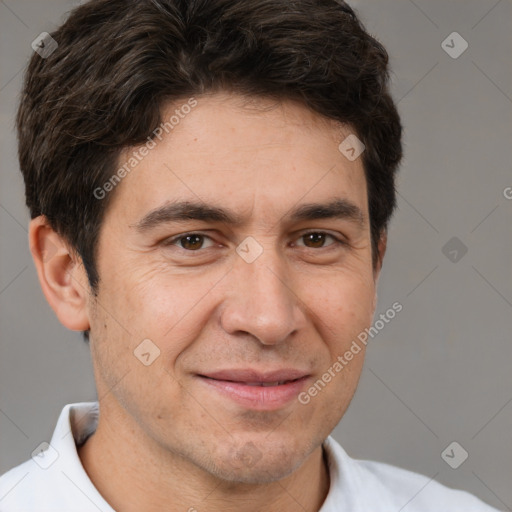 Joyful white young-adult male with short  brown hair and brown eyes