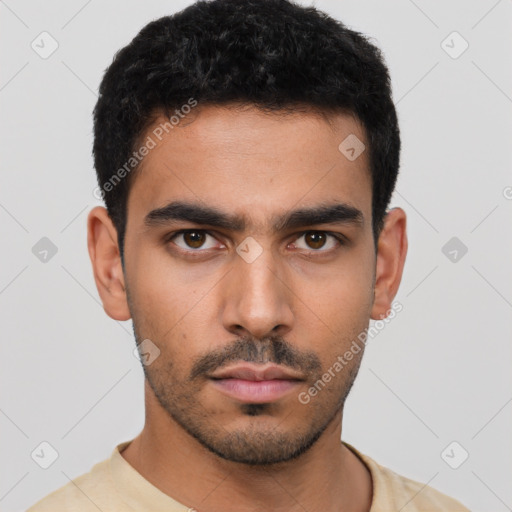 Neutral latino young-adult male with short  black hair and brown eyes