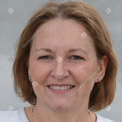 Joyful white adult female with medium  brown hair and grey eyes