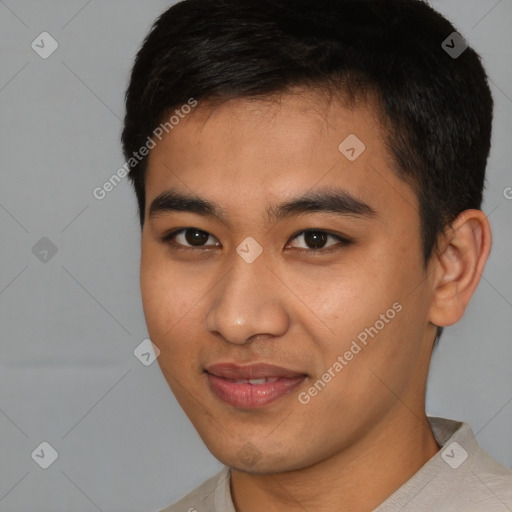 Joyful asian young-adult male with short  black hair and brown eyes