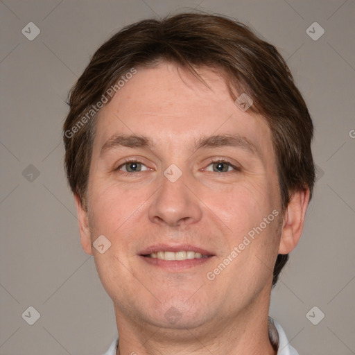 Joyful white adult male with short  brown hair and grey eyes