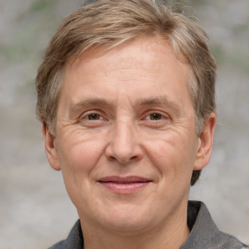 Joyful white middle-aged male with medium  brown hair and grey eyes