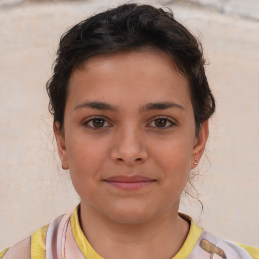 Joyful white child female with short  brown hair and brown eyes