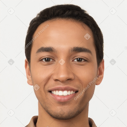 Joyful latino young-adult male with short  black hair and brown eyes