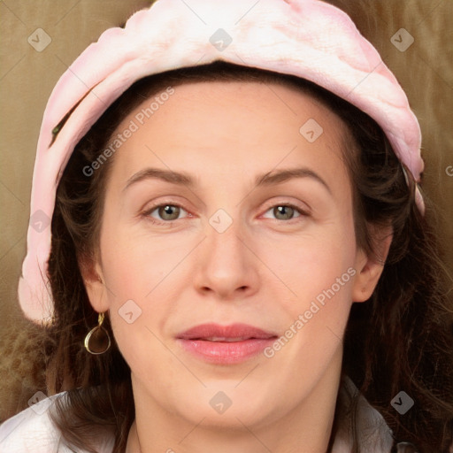 Joyful white adult female with long  brown hair and grey eyes