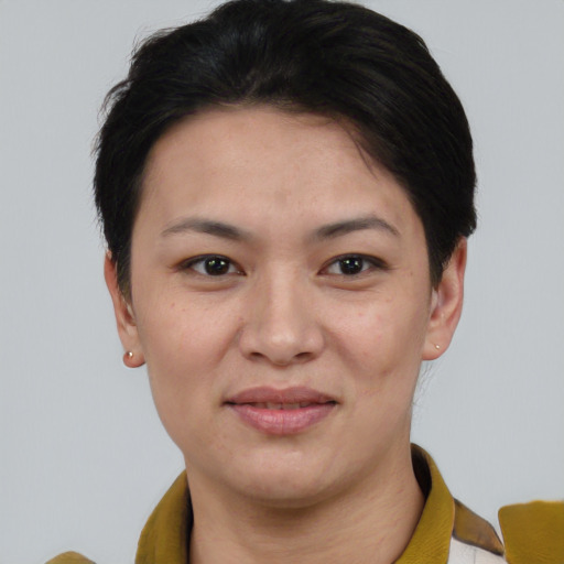 Joyful white young-adult female with short  black hair and brown eyes