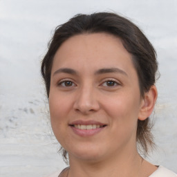 Joyful white young-adult female with medium  brown hair and brown eyes