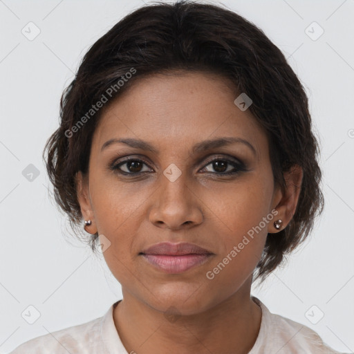 Joyful black young-adult female with medium  brown hair and brown eyes