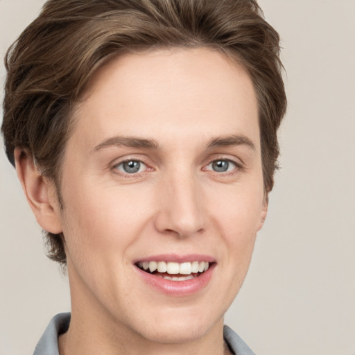 Joyful white young-adult female with short  brown hair and grey eyes